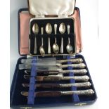 A set of six silver teaspoons and silver handled knives