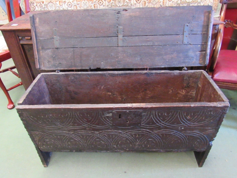 A 17th Century six plank oak coffer with carved lunette frieze, top split, - Image 2 of 2