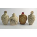 Two stone opium bottles embossed with figural decoration,