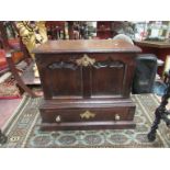 A George III style oak miniature coffer with drawer below, Fielded panel front,