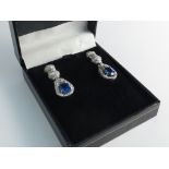 A pair of sapphire and diamond drop cluster earrings,