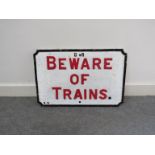 A 1940's Caledonian Railway cast iron painted "Beware of Trains" sign,