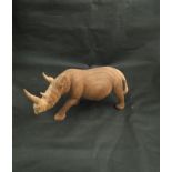 A carved wooden rhino