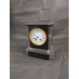 A late 19th Century mantel clock with white enamel face,