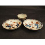 A Lowestoft two bird pattern tea bowl and two saucers,