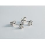 A pair of diamond stud earrings, .