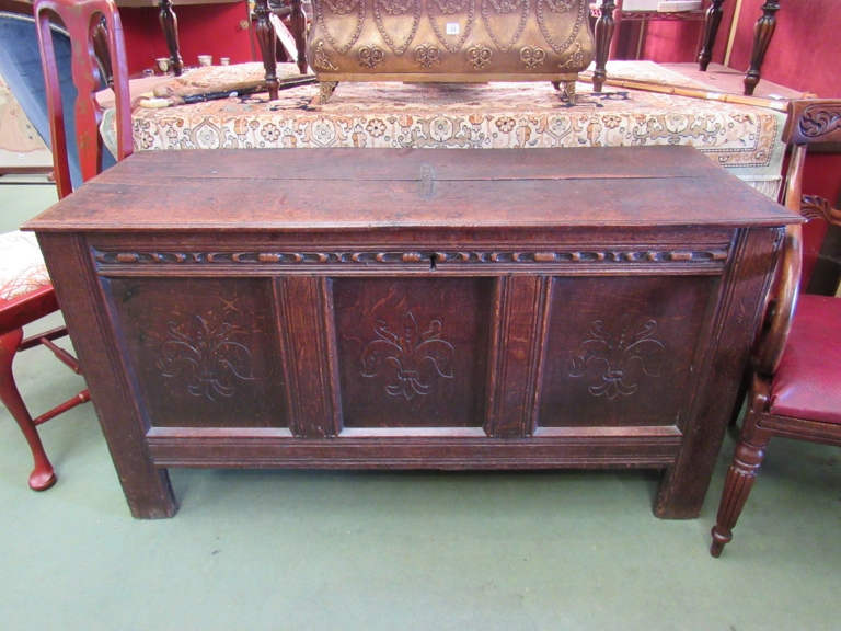 An 18th Century oak triple panel coffer with strengthening bar to top, a/f,