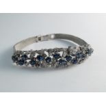 A white gold sapphire and diamond encrusted bracelet