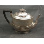 A Walker & Hall silver teapot with melon fluted body inscribed "Presented by the Lady Northwick to