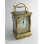 A late 19th/early 20th Century French brass carriage clock with Art Nouveau influenced case,