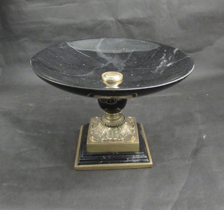 A black marble and brass table centrepiece with acanthus leaf design stepped base, 20cm tall,