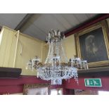 An ornate French ormolu and crystal glass drop electrolier with 15 light sconces facetted drops and