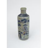 An early 20th Century Chinese blue and white snuff bottle painted with figure with hoe,