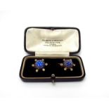 A decorative pair of early 20th Century brooches set with clear stones