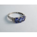 A 9ct gold tanzanite and diamond ring