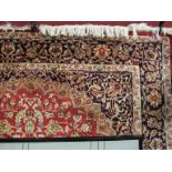 A modern red ground Keshan rug 2.3 x 1.