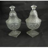 A pair of 19th Century antique cut glass covered bowls on square bases,