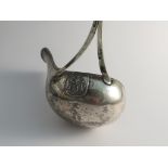 A 19th Century Dutch silver toddy ladle with ornately carved ivory handle,