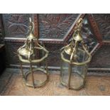 A pair of brass ceiling light fixtures,