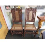 A pair of 18th Century & later carved walnut bergere chairs with barley twist supports and
