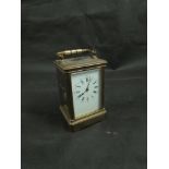 A 19th Century French brass carriage clock with enamel dial (hairlined) with Roman numerals and