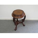 A mid Victorian carved oak jardiniere stand the dish circular top with concentrical line decoration