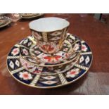 A set of twelve Royal Crown Derby cups, saucers, side plates and two cake plates,