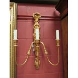 A pair of gold painted three arm wall lights,