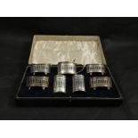 A silver seven piece cruet set with pierced detail,