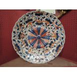 An early 19th Century Japanese Imari pattern charger, embossed Chrysanthemum to centre,