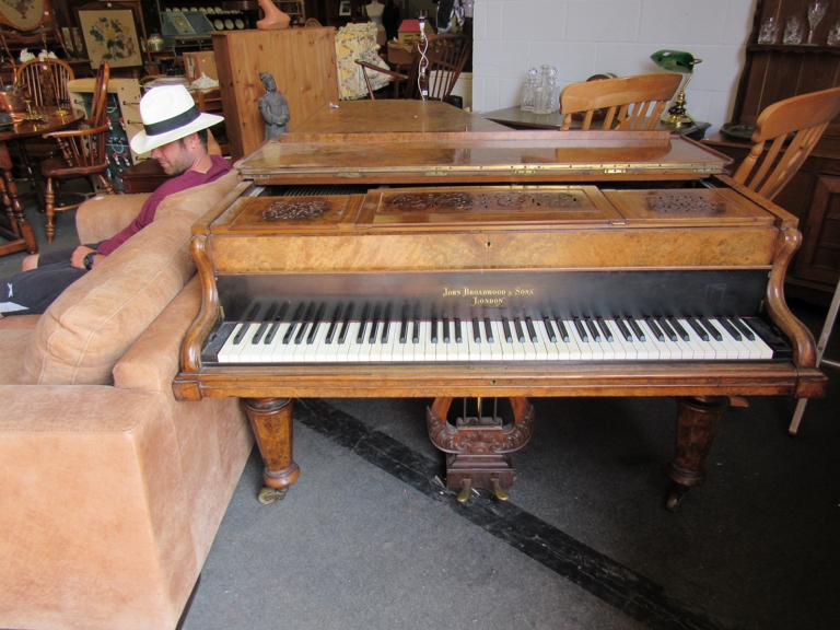 A walnut John Broadwood and Sons boudoir grand piano (7' x 4' 6") A to A,