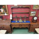 A Georgian oak slim dresser with open plate-rack top possibly a marriage,