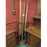 An early Edwardian Orme & Sons Ltd revolving free-standing snooker cue stand with cues and chalk