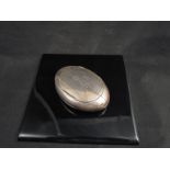 A Henry Williamson Ltd, snuff box of rugby ball form, dented, Birmingham 1905,