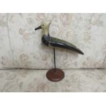 A wooden painted figure of a lapwing,