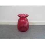 A large cranberry glass lamp shade,