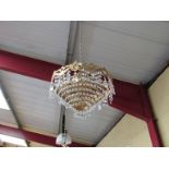 A French ormolu and crystal glass tiered drop chandelier,