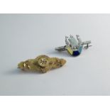 A Victorian 15ct gold brooch and silver enamel brooch in the form of a three mast ship (2)