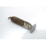 A 19th Century horn handled seal with embossed white metal decoration - blank