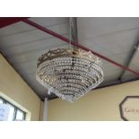 A French ormolu and crystal circular tiered chandelier,
