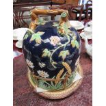 A George Jones Majolica daisy pattern stilton cover and stand,