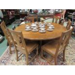 An "Acorn Man" honeycomb table and six chairs with studded leather seats,