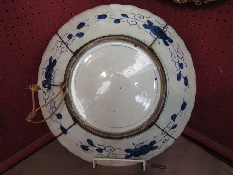 An early 19th Century Japanese Imari pattern charger, embossed Chrysanthemum to centre, - Image 2 of 2