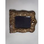 A silver embossed easel back photograph frame, makers mark R.B.