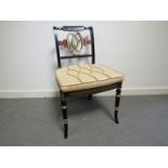 A set of twelve Regency style ebonised dining chairs,