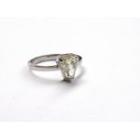 An 18ct white gold ring set with calf's head shaped diamond, colour fancy pale yellow, 1.