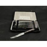 A set of silver handled butter knives with scallop decoration, stainless steel blades,