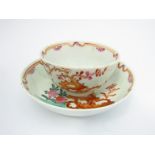 A Lowestoft porcelain tea bowl and saucer,