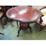 A circa 1840 a flame mahogany lamp table with dish shaped top and carved borders over turned