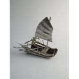 A Chinese silver junk, marked,